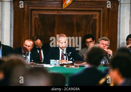 United States Senator Joseph Biden (Democrat of Delaware), Chairman, US Senate Committee on the Judiciary, chairs the confirmation hearing for Judge Robert Bork, US President Ronald Reagan's nominee to succeed Associate Justice of the Supreme Court Louis Powell on Capitol Hill in Washington, DC on September 21, 1987. Looking on from left is US Senator J. Strom Thurmond (Republican of South Carolina), and at right is US Senator Edward M. “Ted” Kennedy (Democrat of Massachusetts).Credit: Ron Sachs/CNP | usage worldwide Stock Photo