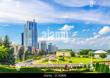Minsk, Belarus, July 26, 2020: cityscape of Minsk city with skyscrapers on Pobediteley Peramohi Avenue in Nemiga district near embankment of Svislach river, blue sky white clouds in sunny summer day Stock Photo