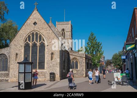 Thetford Norfolk, view in summer of people walking past St Cuthbert's Church in King Street - the main shopping street in Thetford, Norfolk,UK Stock Photo