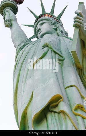 The Statue of Liberty is a colossal copper statue designed by Auguste Bartholdi a French sculptor was built by Gustave Eiffel. Stock Photo