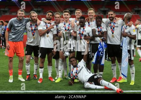 London, UK. 04th Aug, 2020. The Fulham playerscelebrate with the trophy after the match. EFL Skybet Championship play off Final, Brentford v Fulham at Wembley Stadium in London on Tuesday 4th August 2020. this image may only be used for Editorial purposes. Editorial use only, license required for commercial use. No use in betting, games or a single club/league/player publications. pic by Steffan Bowen/Andrew Orchard sports photography/Alamy Live news Credit: Andrew Orchard sports photography/Alamy Live News Stock Photo