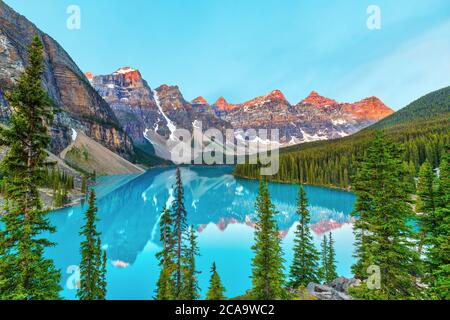 Summer sunrise lighting up the Valley of the Ten Peaks at Moraine Lake near Lake Louise in the Canadian Rockies of Banff National Park, Alberta, Canad Stock Photo
