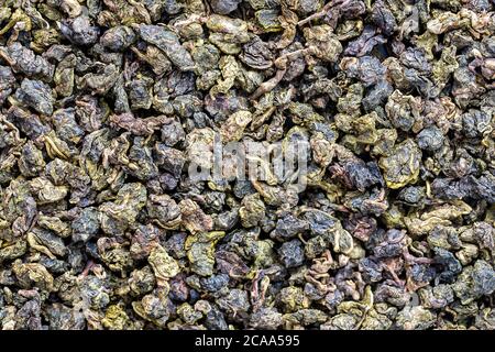 Green tea leaves background. Oolong tea close up. Abstract food textures. Top view. The high end tea of Vietnam Stock Photo