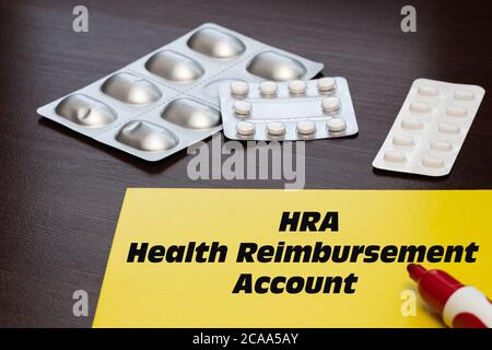 Health Reimbursement Account HRA, the text is written on a yellow sheet. The concept of medical care or medical assistance Stock Photo