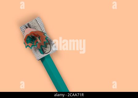 sharpened pencil sharpener when used on white background Stock Photo