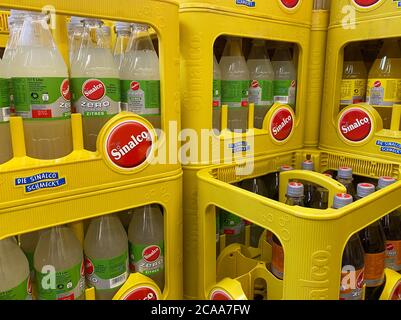 Viersen, Germany - July 9. 2020: View on isolated stacked yellow Sinalco soft drink crates in german beverage store Stock Photo
