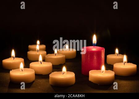 The odd one - Playing with different candles Stock Photo