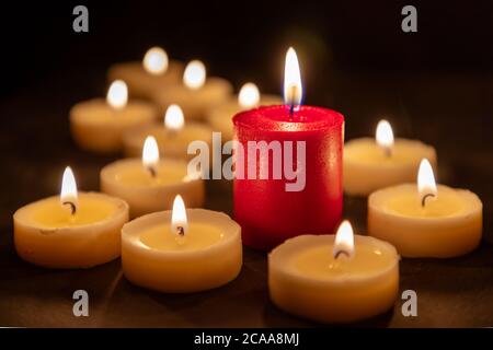 The odd one - Playing with different colored candles Stock Photo