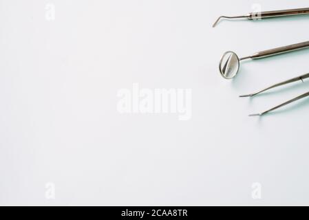 Dentist tools. Teethcare, dental health concept. Blue background top view copy space. Stock Photo