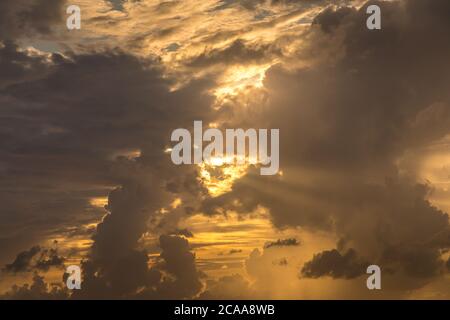 Dramatic clouds in the evening with sun rays Stock Photo