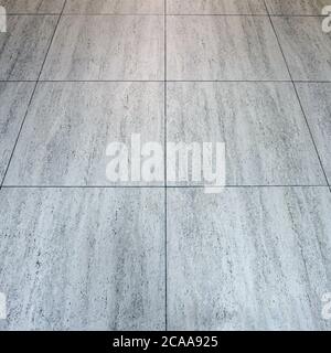 Floor tiles texture. Grey tiled floor in a clean condition with grid lines for the background. Stock Photo