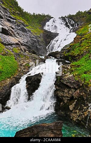 Kjosfossen Falls -cascading waterfall popular with tourists, accessible by a scenic train ride of Flåm - Myrdal railway.Rallarvegen,Myrdal, Norway Stock Photo