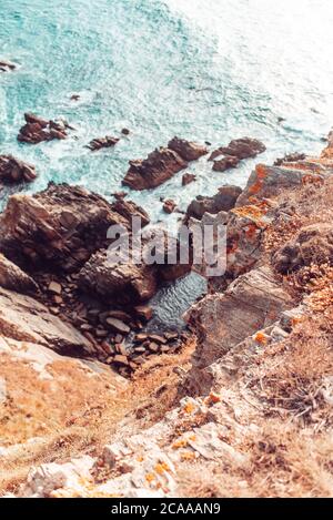 Details of rocks near the sea, on the bottom of a high cliff in Galicia, Spain Stock Photo