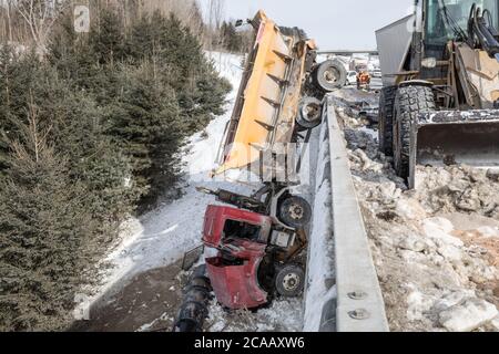 Snow truck falls off overpass Stock Photo