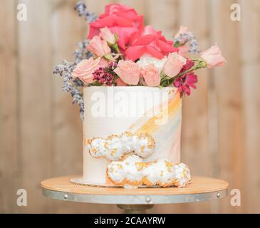 White Birthday cake with rainbow icing and colorful Sprinkles over a ...