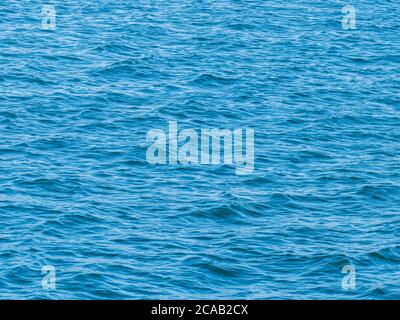 sea ​​surface seen in evening light by day Stock Photo