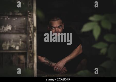 Portrait of African American/black man posing in dark abandoned house in Kentucky Stock Photo