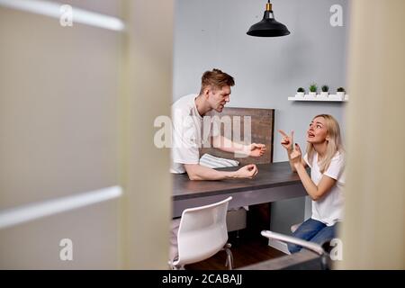 relationship of married couple is undergoing a crisis, they are quarreling, sort things out and scream. they are dissatisfied with each other Stock Photo