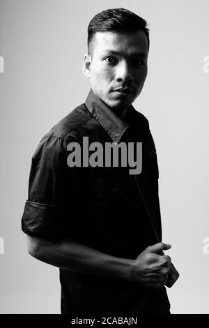 Portrait of young Asian businessman in black and white Stock Photo