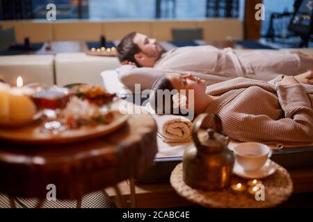 young man and woman, couple in love relaxing together at spa salon, after enjoying treatment, health and body care, holiday weekend Stock Photo