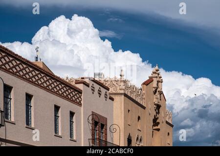 Lensic Theater set against puffy cumulus clouds in downtown Santa Fe New Mexico Stock Photo