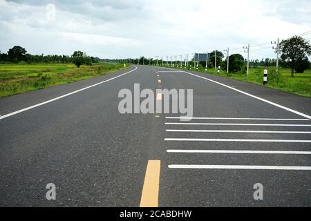 Asphaltic concrete road in Thailand Stock Photo