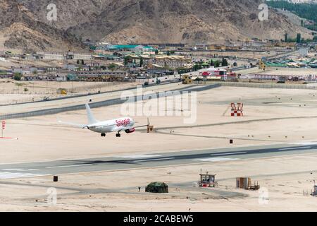 Ladakh, India - Spicejet Boeing 737 landing at Leh airport (Kushok Bakula Rimpochee Airport) view from Spituk Monastery in Ladakh, India. Stock Photo