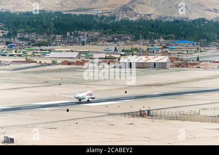 Ladakh, India - Spicejet Boeing 737 landing at Leh airport (Kushok Bakula Rimpochee Airport) view from Spituk Monastery in Ladakh, India. Stock Photo