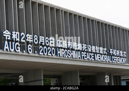 Hiroshima, Japan. 6th Aug, 2020. A signboard of the Hiroshima Peace Memorial Ceremony 2020 is on display at the entrance of the Peace Memorial Park. Local authorities implemented measures to prevent the spreading of the new coronavirus during the annual memorial ceremony at the Peace Memorial Park in Hiroshima. This year marks the 75th anniversary of the atomic bombing in Hiroshima and Nagasaki by the United States during World War II. Credit: Rodrigo Reyes Marin/ZUMA Wire/Alamy Live News Stock Photo
