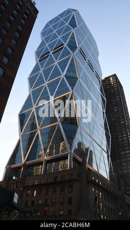 New York City, New York, USA. 5th Aug, 2020. The Hearst Tower, headquarters of Hearst Magazines at 300 W. 57th Street in New York City is shown Wednesday August 5, 2020. Chief Executive Troy Young resigned in late July after allegations of a toxic work environment. The striking modern tower completed in 2006 was designed by (Lord Norman) Foster   Partners. It rises from the middle of the original six story building commissioned in 1928 by publishing magnate William Randolph Hearst. Credit: Mark Hertzberg/ZUMA Wire/Alamy Live News Stock Photo