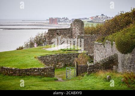 Heysham Cliff  St Patrick's Chapel Anglo-Saxon style doorway in the ruins overlooking the bay Stock Photo