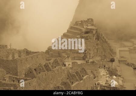 Grayscale shot of the Machu Picchu ruins in Peru Stock Photo
