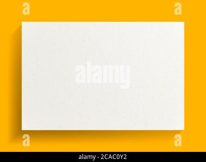 White canvas frame on yellow background with soft shadow. Stock Photo