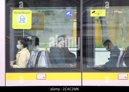 Beijing, China. 6th Aug, 2020. People wearing face masks are seen on a tram in Dublin, Ireland, July 13, 2020. TO GO WITH XINHUA HEADLINES OF AUG. 6, 2020 Credit: Xinhua/Alamy Live News