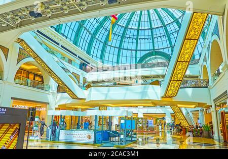 DUBAI, UAE - MARCH 5, 2020: The foyer of Mall of the Emirates with glass vault, multi-level construction, escalators, decorated with fine patterns and Stock Photo