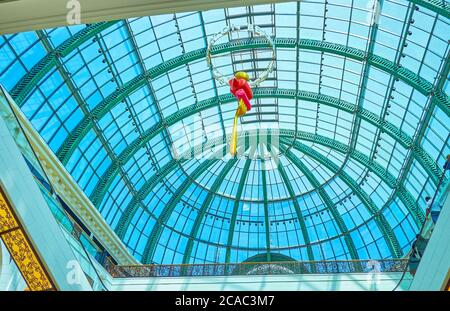 DUBAI, UAE - MARCH 5, 2020: The installation under the glass vault of Mall of the Emirates in shape of fork with food, on March 5 in Dubai Stock Photo