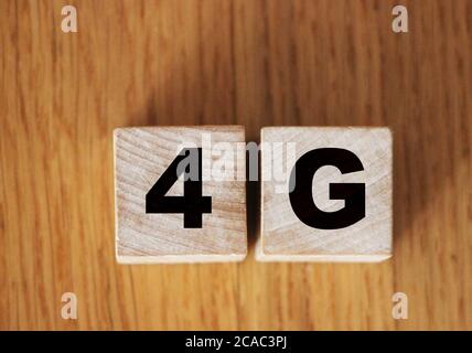 wooden blocks with 4G sign. Technology, network, communication concept Stock Photo