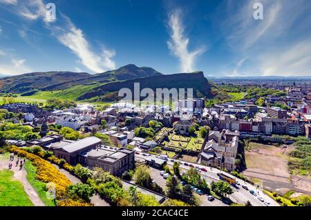View towards Arthur's Seat in Edinburgh Scotland from Calton Hill with the former Royal High School building in the foreground. Stock Photo