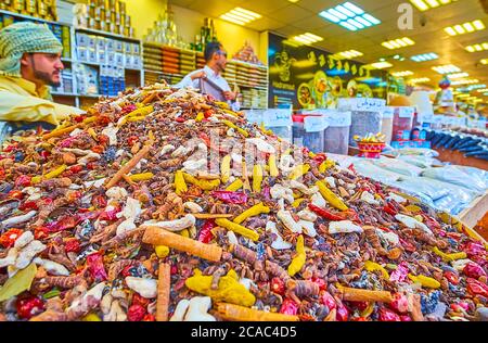 DUBAI, UAE - MARCH 5, 2020: The heap of colored spices, including cinnamon, pepper, ginger, star anice in Yemen pavilion of Global Village Dubai, on M Stock Photo