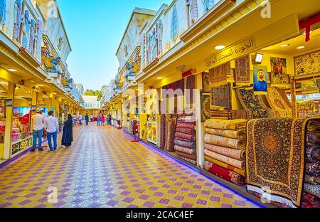 DUBAI, UAE - MARCH 5, 2020: The alley of Iran pavilion of Global Village Dubai with carpet, spice, perfume and other stalls, on March 5 in Dubai Stock Photo