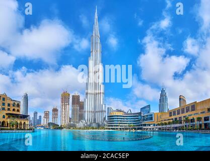 DUBAI, UAE - MARCH 3, 2020: The cityscape of modern Downtown district with Burj Khalifa Lake and the main landmark of the neighborhood, Burj Khalifa b Stock Photo