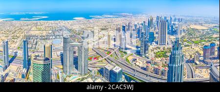 DUBAI, UAE - MARCH 3, 2020: Panoramic view on skyline of Dubai city with modern business center and residential neighborhoods and seashore of Persian Stock Photo