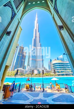 DUBAI, UAE - MARCH 3, 2020: The view on Burj Khalifa tower through entrance arch of Al Bahar Souq, on March 3 in Dubai Stock Photo