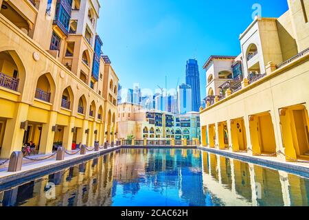 DUBAI, UAE - MARCH 3, 2020: The inner courtyard with a small pool on the roof of Old Town Island's buildingds with outdoor terrace of restaurant, on M Stock Photo