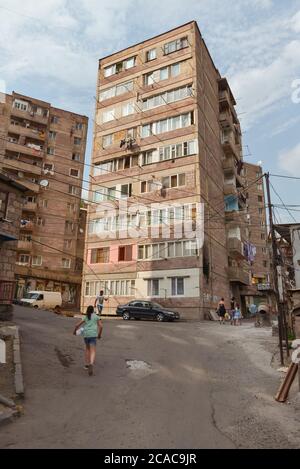 Alaverdi / Armenia - July 20, 2019: Soviet style buildings and vehicles from the streets of Alaverdi Stock Photo