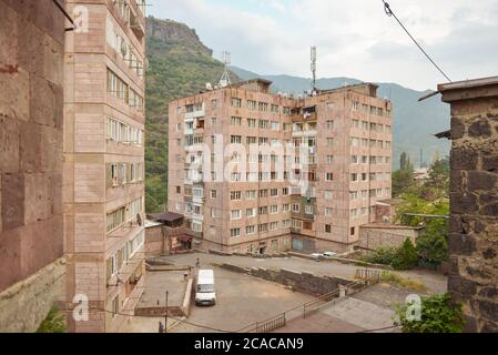 Alaverdi / Armenia - July 20, 2019: Soviet style buildings and vehicles from the streets of Alaverdi Stock Photo