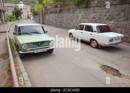 Alaverdi / Armenia - July 20, 2019: Soviet style buildings and vehicles from the streets of Alaverdi Stock Photo