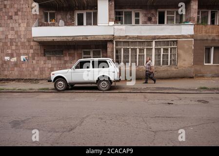 Alaverdi / Armenia - July 20, 2019: Soviet style buildings and vehicles from the streets of Alaverdi Stock Photo