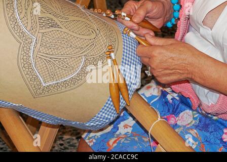 woman working on bobbin lace Stock Photo