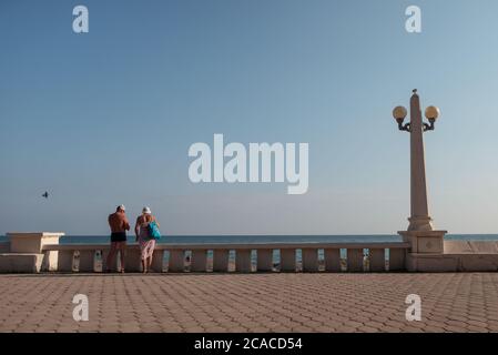 Sukhumi / Abkhazia - August 2, 2019: Russian couple enjoying view of the sea on the capital's promenade Stock Photo